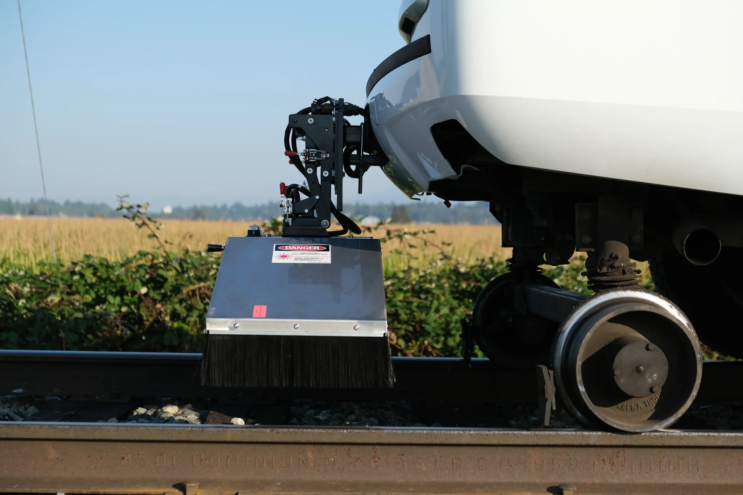 Side profile of one of Andian Technologies products: Laser Profiler, mounted on railway track. Measures rail profiles for railway geometry testing.